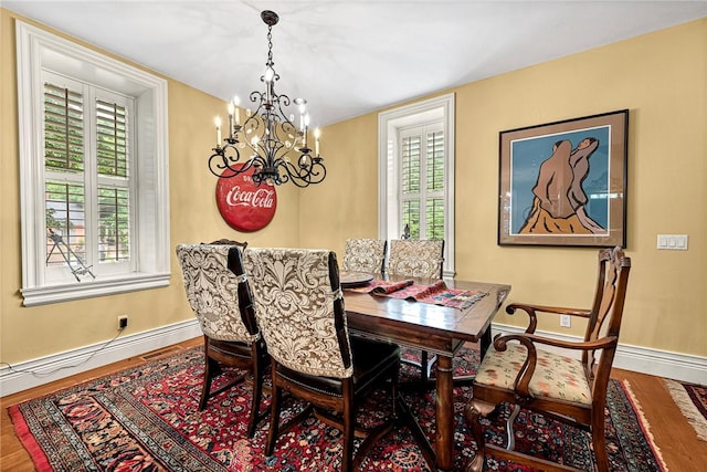 32 Armstrong St, Eureka Springs, AR 72632 - dining room featuring a chandelier and wood finished floors