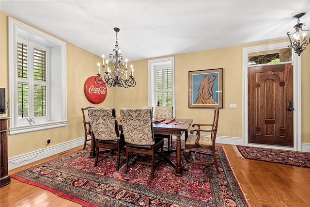 32 Armstrong St, Eureka Springs, AR 72632 - dining room with a chandelier and wood finished floors