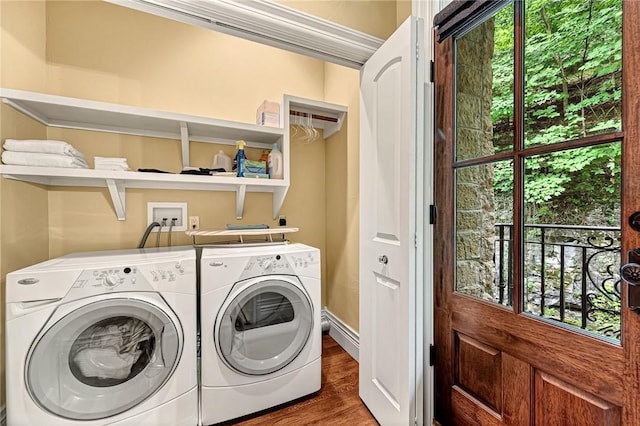 32 Armstrong St, Eureka Springs, AR 72632 - washroom featuring independent washer and dryer, wood finished floors, and healthy amount of natural light