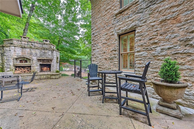 32 Armstrong St, Eureka Springs, AR 72632 - view of patio / terrace with an outdoor stone fireplace