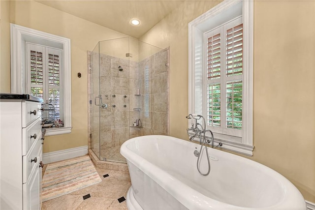 32 Armstrong St, Eureka Springs, AR 72632 - bathroom with a shower stall, a freestanding tub, healthy amount of natural light, and recessed lighting