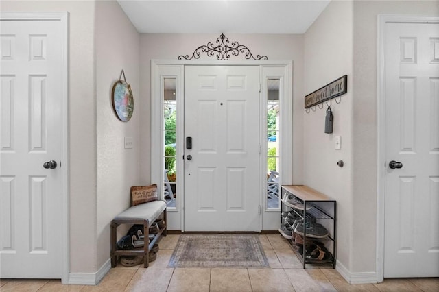 16 Olmsted Ln, Bella Vista, AR 72715 - entrance foyer with light tile patterned flooring and baseboards