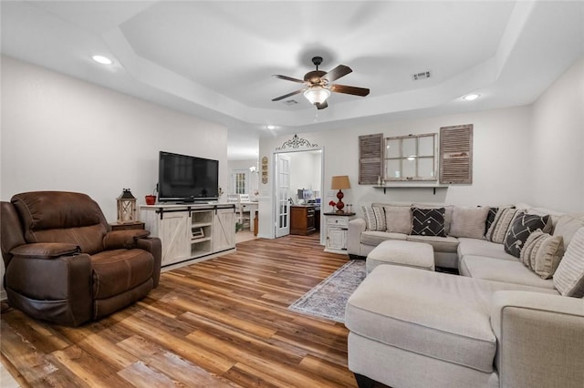 16 Olmsted Ln, Bella Vista, AR 72715 - living room with a tray ceiling, wood finished floors, recessed lighting, and ceiling fan