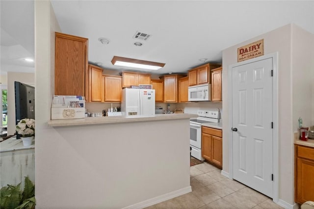 16 Olmsted Ln, Bella Vista, AR 72715 - kitchen featuring white appliances, light countertops, light tile patterned floors, and a peninsula