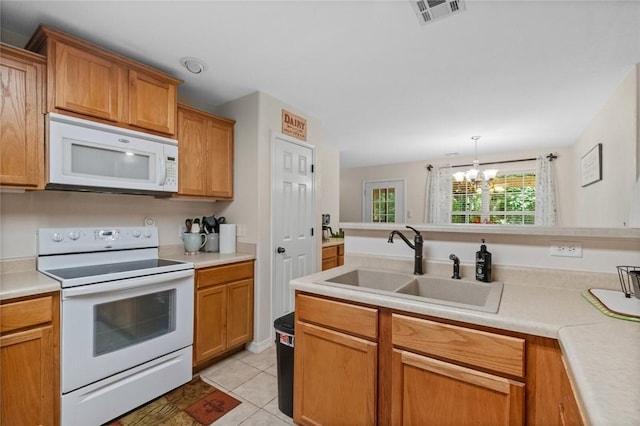 16 Olmsted Ln, Bella Vista, AR 72715 - kitchen featuring white appliances, light countertops, and a chandelier