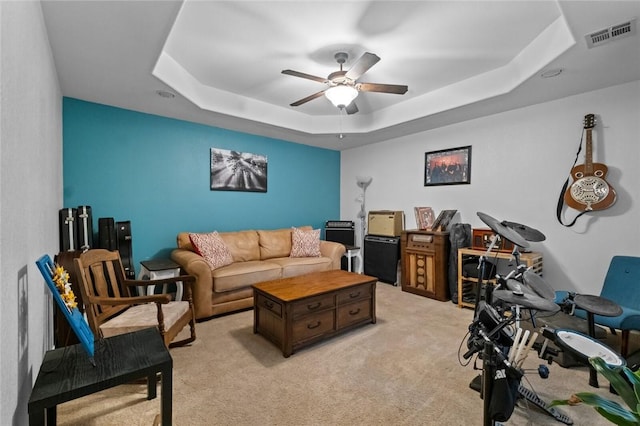 16 Olmsted Ln, Bella Vista, AR 72715 - living room with a raised ceiling, a ceiling fan, and light carpet