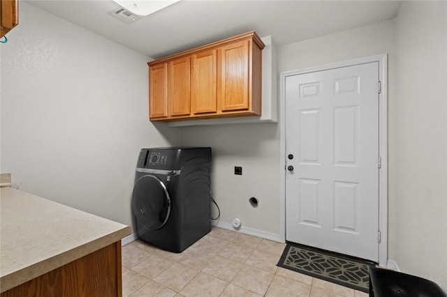 16 Olmsted Ln, Bella Vista, AR 72715 - washroom with washer / clothes dryer, cabinet space, and light tile patterned floors