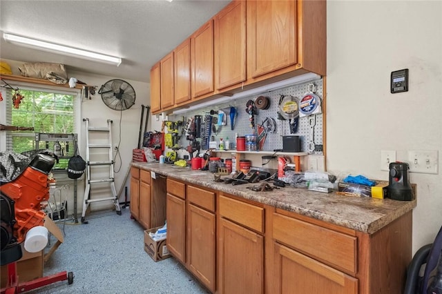 16 Olmsted Ln, Bella Vista, AR 72715 - kitchen with dark speckled floor and light countertops