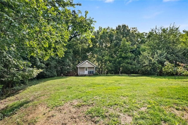 16 Olmsted Ln, Bella Vista, AR 72715 - view of grassy yard featuring a wooded view