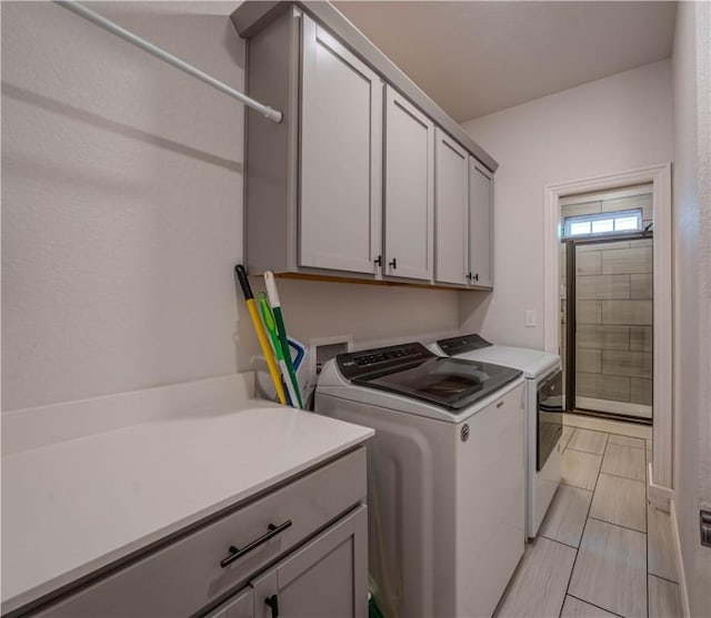1312 Park St, Lowell, AR 72745 - laundry room with washer and dryer and cabinet space