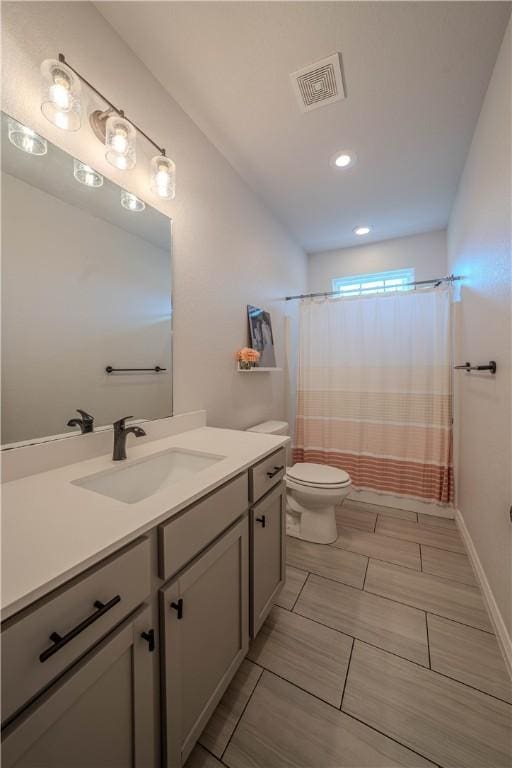 1312 Park St, Lowell, AR 72745 - bathroom with vanity, recessed lighting, and shower / bathtub combination with curtain
