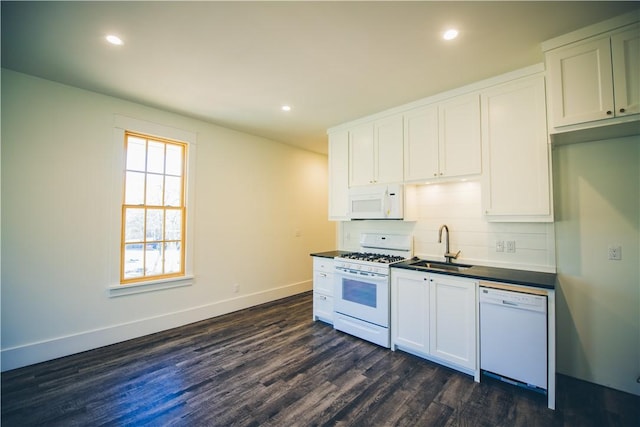 218 E S St, Fayetteville, AR 72701 - kitchen with white appliances, dark wood-type flooring, white cabinets, dark countertops, and recessed lighting