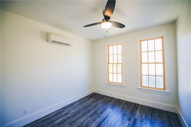 218 E S St, Fayetteville, AR 72701 - spare room with a wall mounted AC, healthy amount of natural light, dark wood finished floors, and a ceiling fan