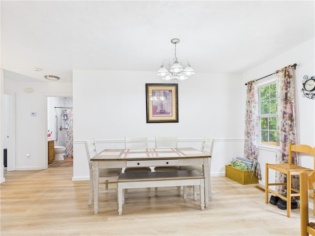 104 Paradise Cove Ln, Berryville, AR 72616 - dining area with light wood-style flooring and a chandelier