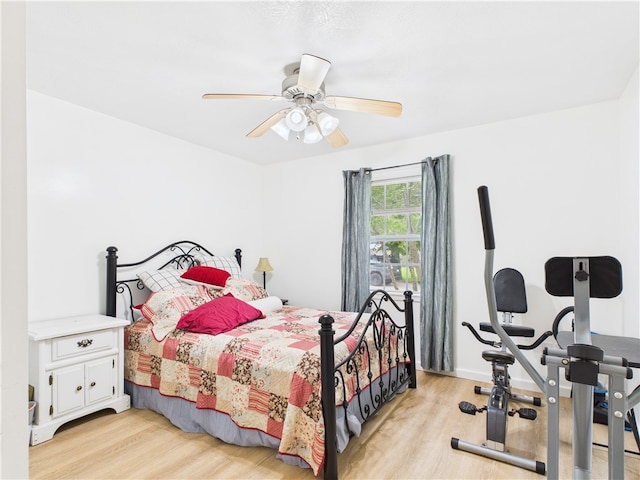 104 Paradise Cove Ln, Berryville, AR 72616 - bedroom with light wood-style flooring and ceiling fan