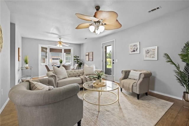 2511 Purdue Cir, Bentonville, AR 72712 - living room featuring ceiling fan and baseboards