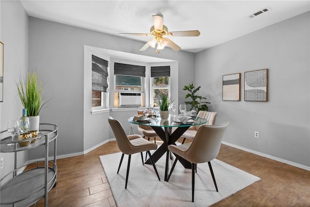 2511 Purdue Cir, Bentonville, AR 72712 - dining space with ceiling fan, cooling unit, and wood finished floors