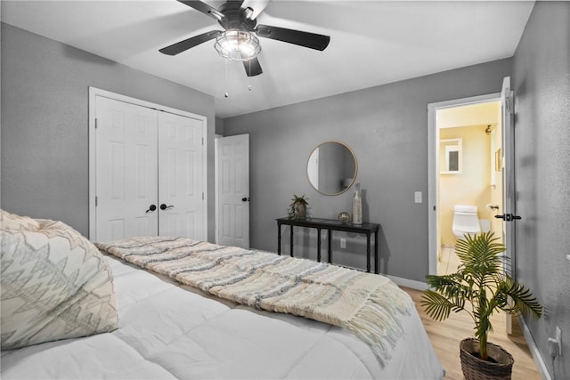 2511 Purdue Cir, Bentonville, AR 72712 - bedroom with a closet, a ceiling fan, and light wood-style floors