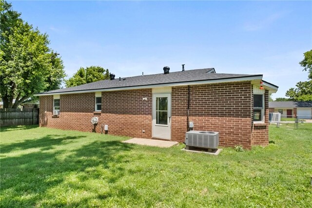 2511 Purdue Cir, Bentonville, AR 72712 - back of property with brick siding and cooling unit