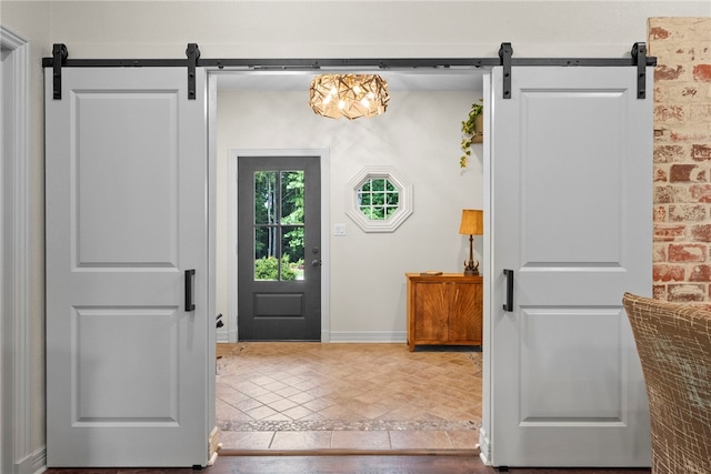 8252 Hickory Tree Ln, Rogers, AR 72756 - tiled foyer entrance with a barn door and inlaid floor details