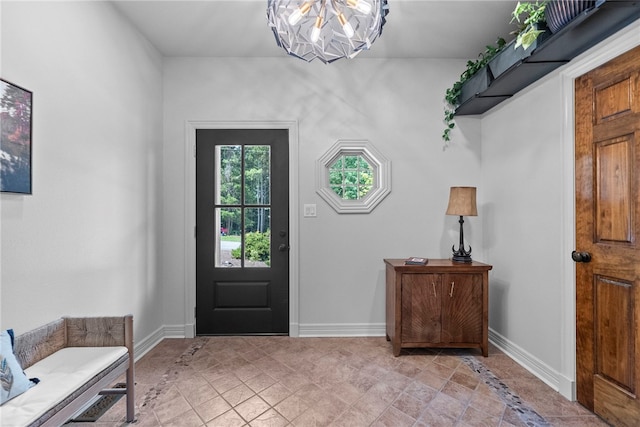 8252 Hickory Tree Ln, Rogers, AR 72756 - foyer entrance with a chandelier and baseboards