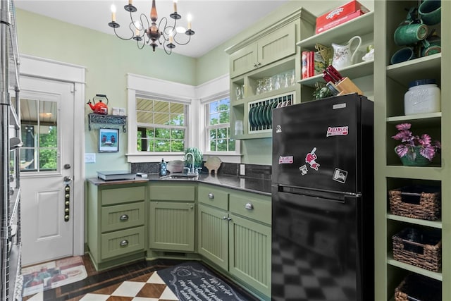 8252 Hickory Tree Ln, Rogers, AR 72756 - kitchen with freestanding refrigerator, green cabinets, open shelves, a chandelier, and dark countertops