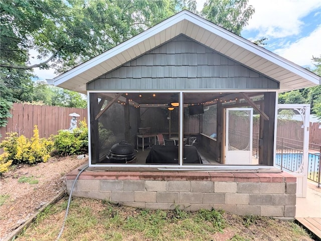 805 S Oak St, Harrison, AR 72601 - rear view of house featuring a sunroom and a fenced backyard