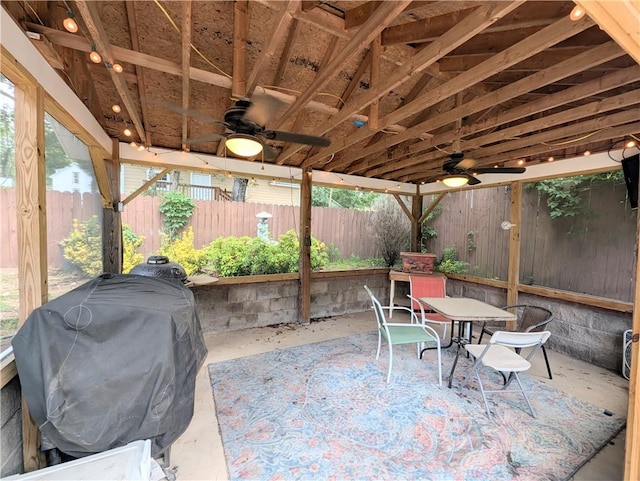 805 S Oak St, Harrison, AR 72601 - fenced backyard featuring a ceiling fan, area for grilling, outdoor dining space, and a patio