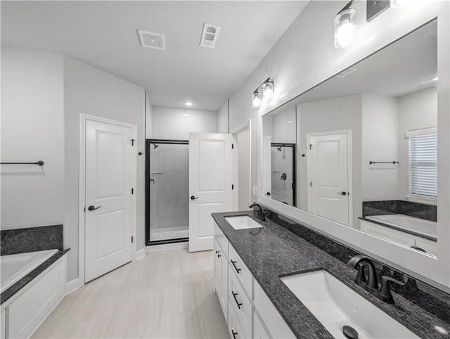 11 Dornoch Cir, Bella Vista, AR 72715 - full bath featuring a stall shower, a bath, double vanity, and recessed lighting