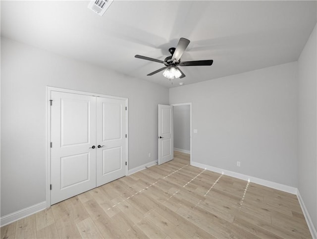 11 Dornoch Cir, Bella Vista, AR 72715 - unfurnished bedroom with light wood-type flooring, a closet, and ceiling fan