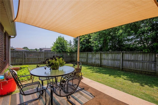 1041 Evergreen St, Centerton, AR 72719 - fenced backyard with a patio and outdoor dining area