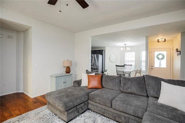 1041 Evergreen St, Centerton, AR 72719 - living area with wood finished floors, a ceiling fan, and a chandelier