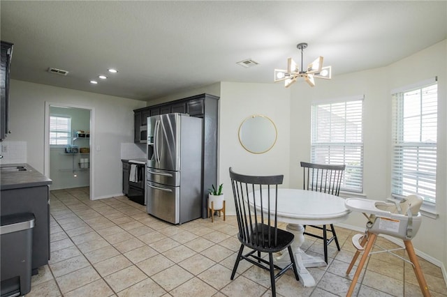 1041 Evergreen St, Centerton, AR 72719 - dining space with a chandelier, recessed lighting, and light tile patterned floors