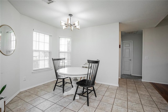 1041 Evergreen St, Centerton, AR 72719 - dining room with a chandelier and light tile patterned floors