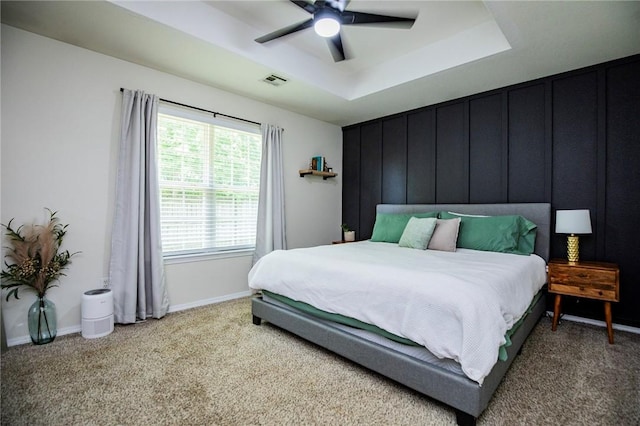 1041 Evergreen St, Centerton, AR 72719 - bedroom with light colored carpet, a tray ceiling, and ceiling fan