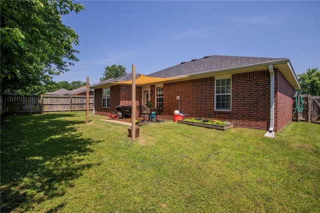 1041 Evergreen St, Centerton, AR 72719 - back of house with brick siding, a fenced backyard, a patio area, and a shingled roof