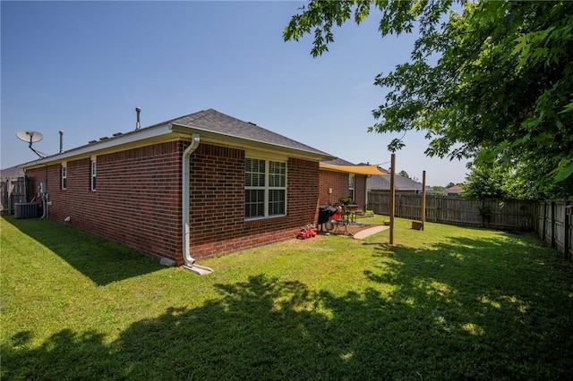 1041 Evergreen St, Centerton, AR 72719 - rear view of house featuring brick siding, a fenced backyard, and a patio area