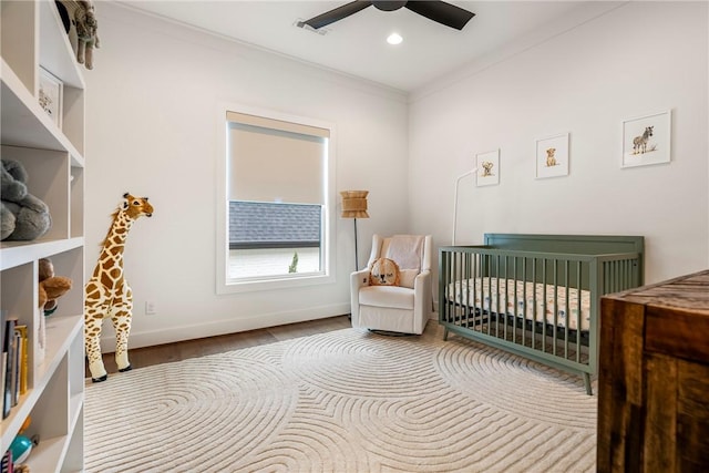8002 W Claverton St, Rogers, AR 72758 - bedroom featuring a nursery area, ornamental molding, wood finished floors, ceiling fan, and recessed lighting