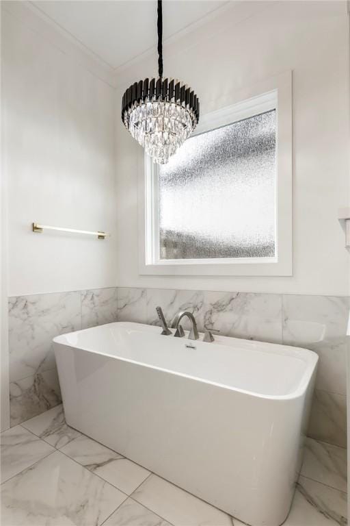 8002 W Claverton St, Rogers, AR 72758 - bathroom featuring tile walls, a soaking tub, marble finish floors, crown molding, and wainscoting
