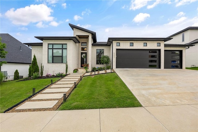 8002 W Claverton St, Rogers, AR 72758 - view of front facade with an attached garage, brick siding, driveway, and a front lawn