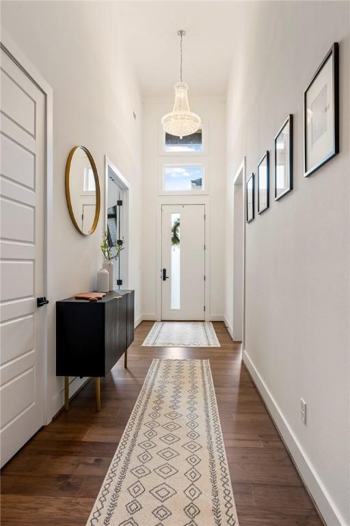 8002 W Claverton St, Rogers, AR 72758 - entryway with a high ceiling, dark wood-type flooring, and a chandelier