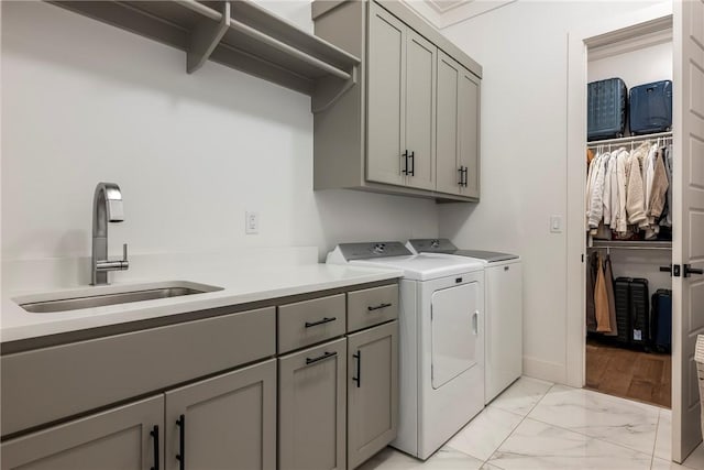 8002 W Claverton St, Rogers, AR 72758 - laundry room featuring cabinet space, independent washer and dryer, and light marble finish flooring