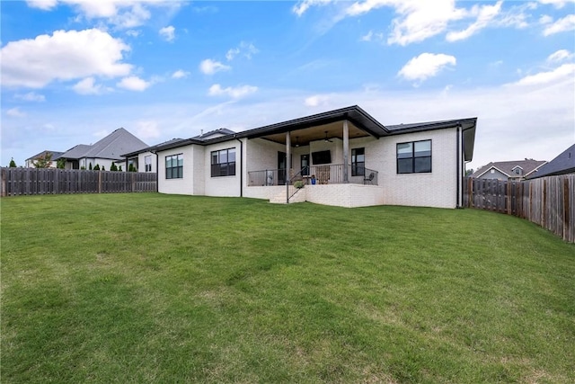 8002 W Claverton St, Rogers, AR 72758 - rear view of property featuring a fenced backyard, a ceiling fan, and a patio area