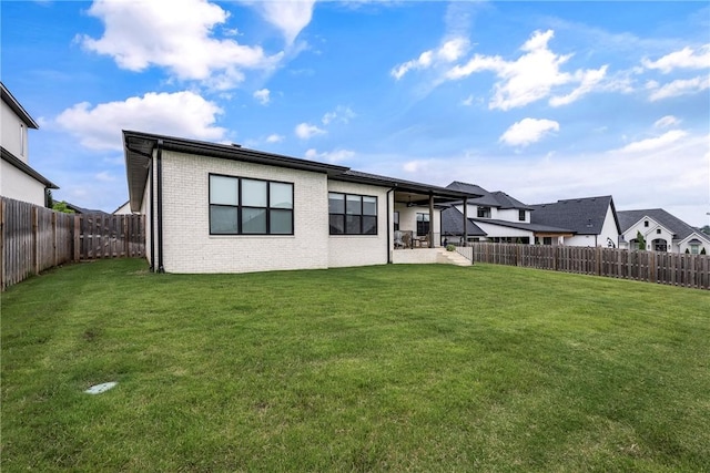 8002 W Claverton St, Rogers, AR 72758 - back of property featuring a fenced backyard, brick siding, and a patio