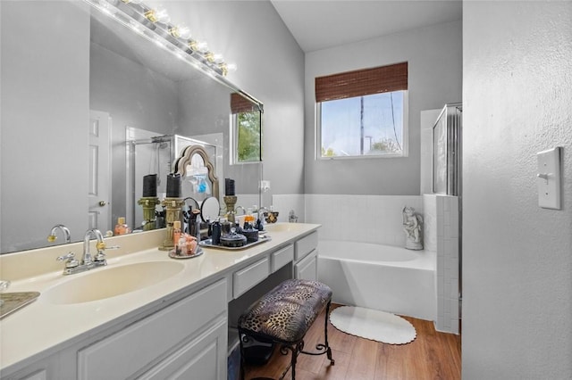6629 Tall Oaks Loop, Springdale, AR 72762 - full bath with a bath, double vanity, a stall shower, and wood finished floors