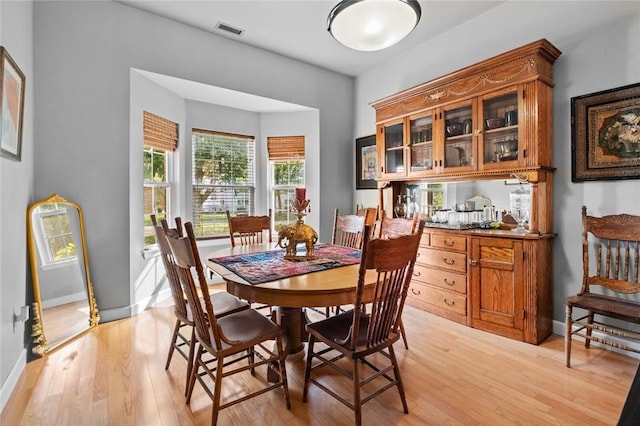 6629 Tall Oaks Loop, Springdale, AR 72762 - dining area with light wood finished floors and baseboards