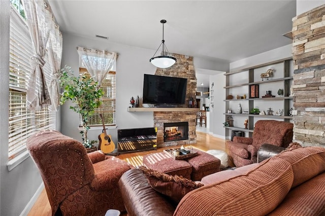 6629 Tall Oaks Loop, Springdale, AR 72762 - living area featuring a fireplace and wood finished floors