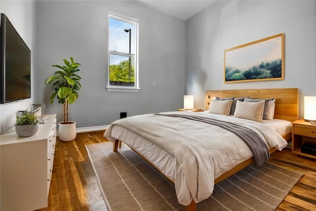 6629 Tall Oaks Loop, Springdale, AR 72762 - bedroom featuring wood finished floors and baseboards