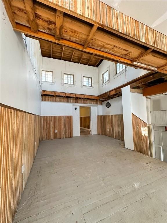 108 Public Sq, Berryville, AR 72616 - misc room with a towering ceiling and wooden walls