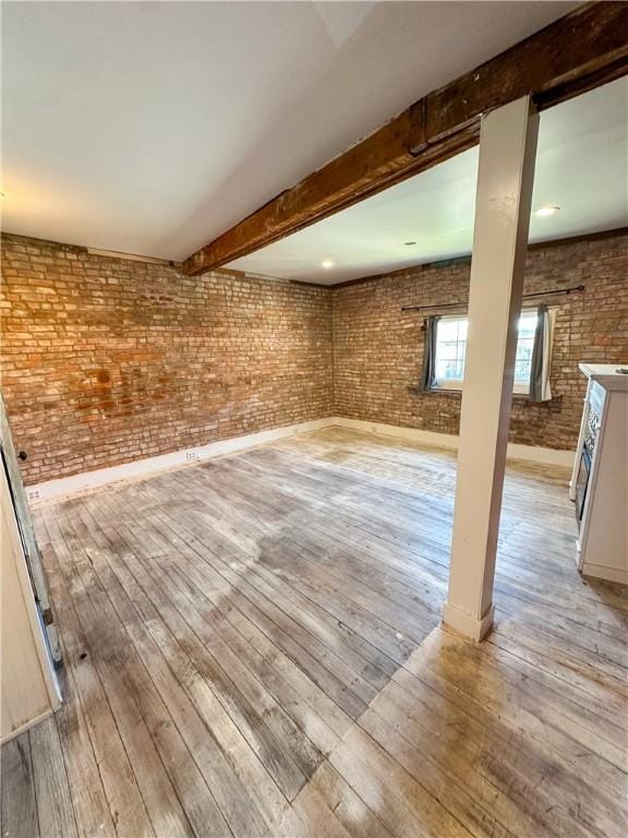 108 Public Sq, Berryville, AR 72616 - below grade area with hardwood / wood-style floors and brick wall